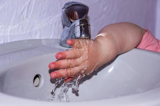 hand under tap water